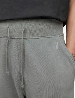 AllSaints Raven Logo-embroidered Tapered-leg Cotton-jersey Jogging Bottoms -Selfridges Store R03969366 STEREOGREY ALT04