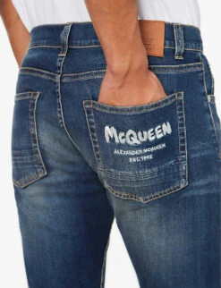 Alexander McQueen Graffiti Brand-embroidered Tapered-leg Regular-fit Stretch-denim Jeans -Selfridges Store R04153535 BLUEWASHED ALT04
