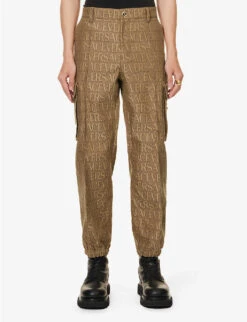 Versace Logo-print Tapered-leg Mid-rise Canvas Trousers -Selfridges Store R04181567 BROWNBEIGE ALT02