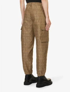 Versace Logo-print Tapered-leg Mid-rise Canvas Trousers -Selfridges Store R04181567 BROWNBEIGE ALT03